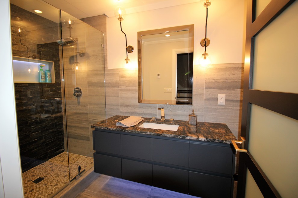 Medium sized contemporary shower room bathroom in Detroit with flat-panel cabinets, black cabinets, an alcove shower, grey tiles, porcelain tiles, white walls, porcelain flooring, a submerged sink, granite worktops, grey floors and a hinged door.