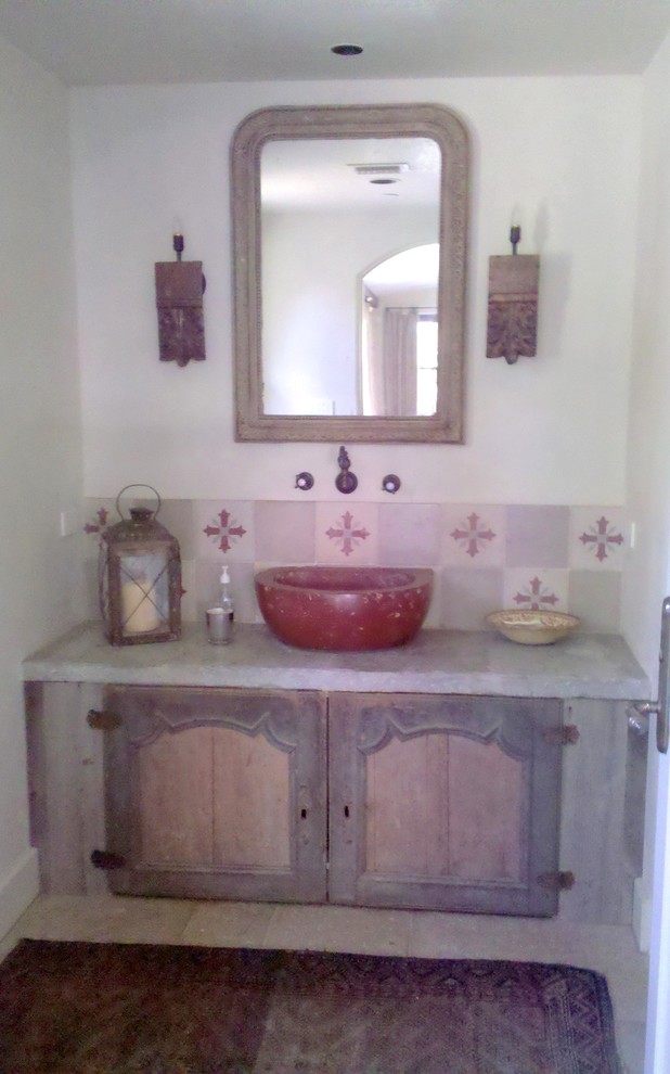 Bathroom - small southwestern 3/4 bathroom idea in Houston with distressed cabinets, white walls and a vessel sink