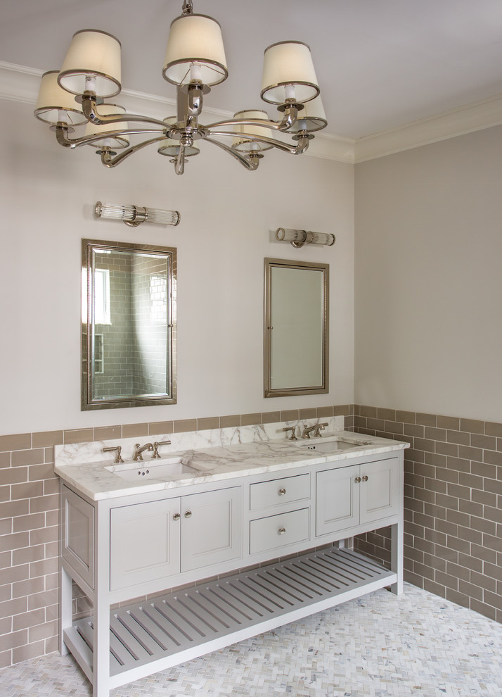Photo of a large beach style ensuite bathroom in Boston with flat-panel cabinets, grey cabinets, a double shower, a one-piece toilet, black and white tiles, ceramic tiles, beige walls, marble flooring, a console sink and marble worktops.