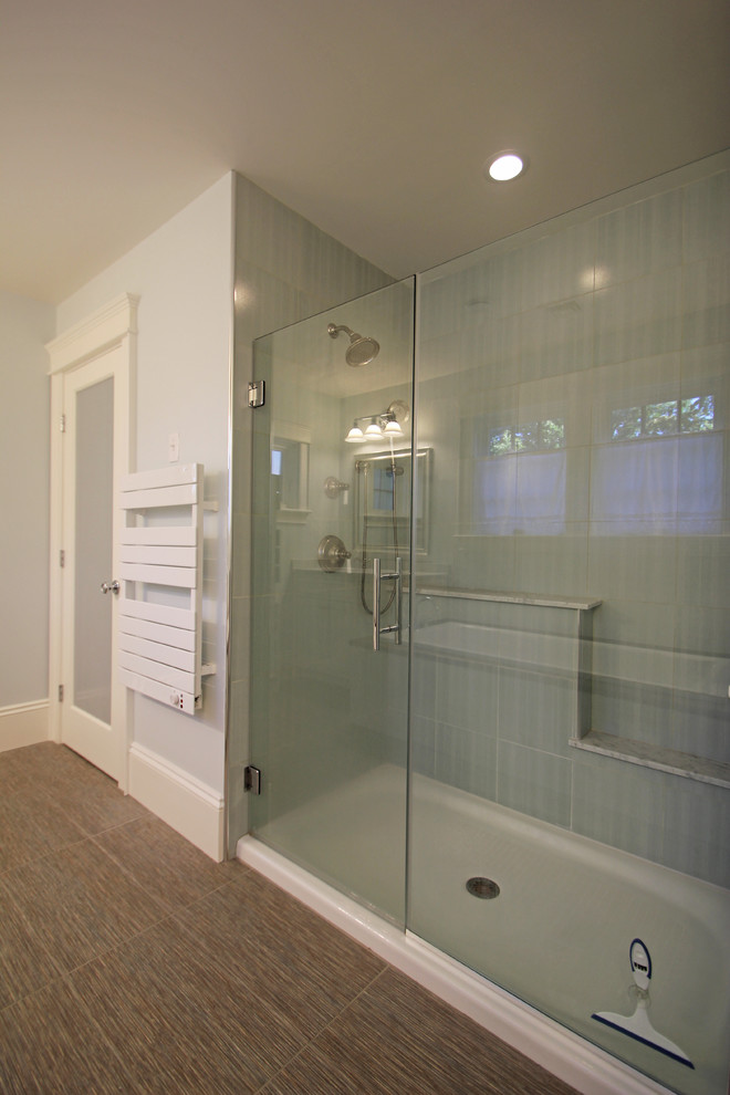 Photo of a medium sized traditional ensuite bathroom in Boston with a submerged sink, shaker cabinets, white cabinets, laminate worktops, a built-in bath, an alcove shower, ceramic tiles, blue walls and porcelain flooring.