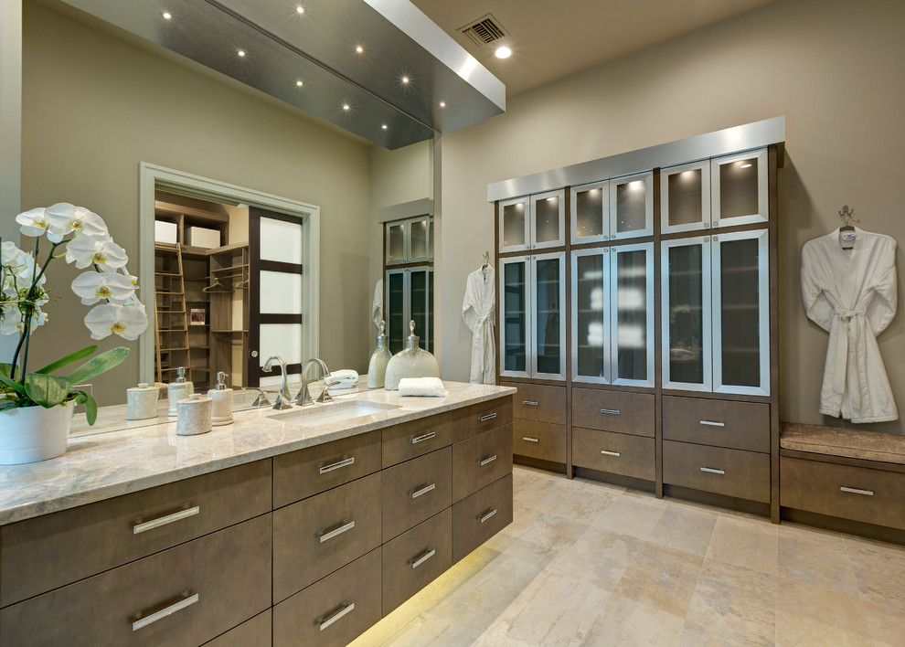 Traditional bathroom in Orlando with a submerged sink, flat-panel cabinets, dark wood cabinets and beige walls.