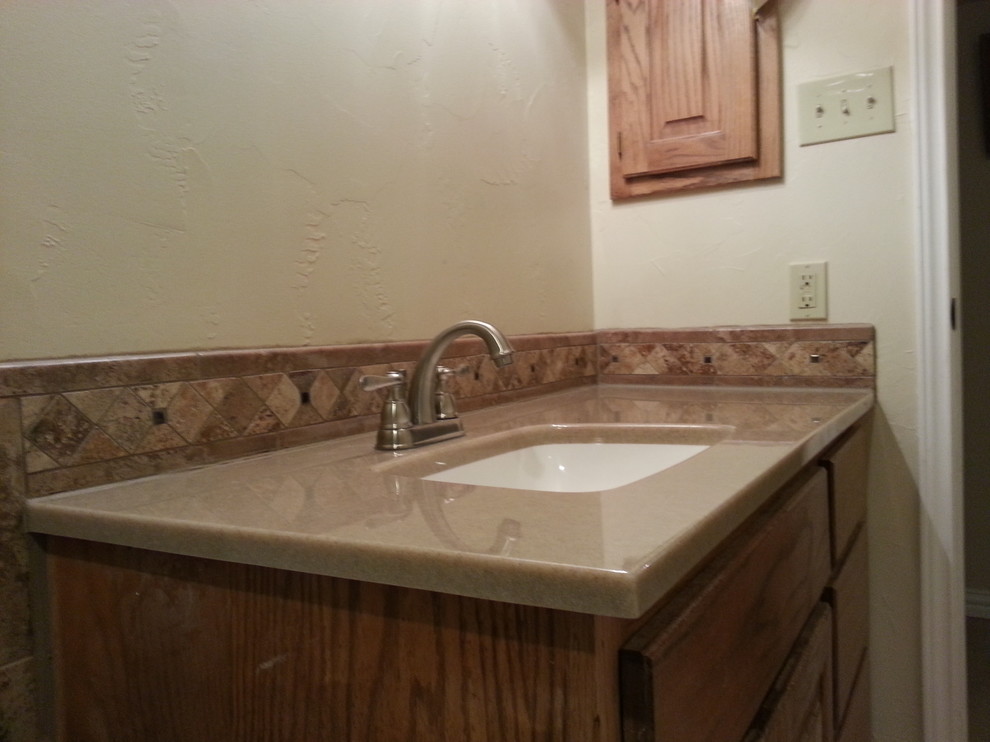 Example of a classic bathroom design in Dallas with onyx countertops