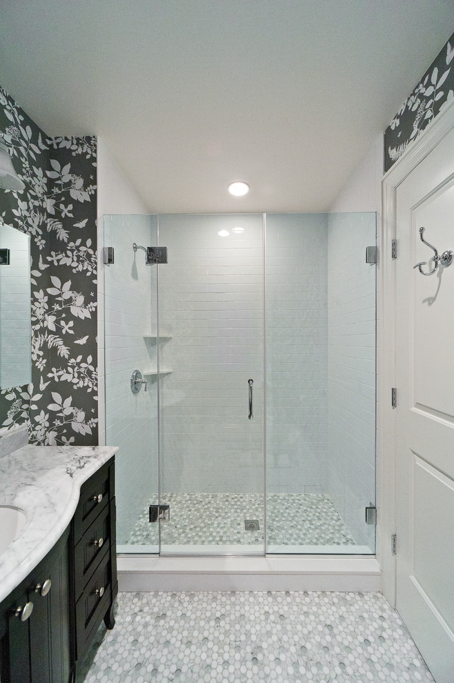 Example of a large trendy white tile and ceramic tile mosaic tile floor alcove shower design in New York with an undermount sink, furniture-like cabinets, black cabinets, marble countertops and white walls