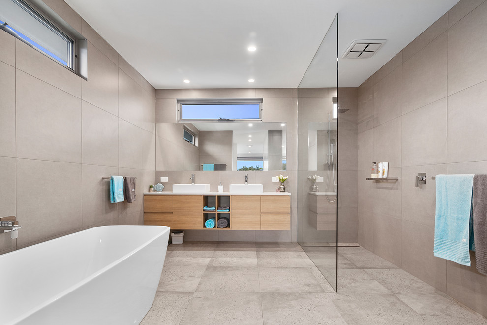 This is an example of a contemporary bathroom in Melbourne with an open shower.