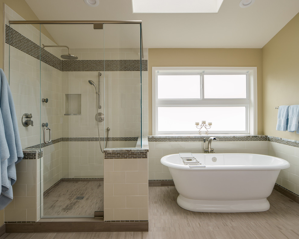 Example of a large transitional master yellow tile and ceramic tile travertine floor bathroom design in Seattle with an undermount sink, recessed-panel cabinets, medium tone wood cabinets, granite countertops and yellow walls