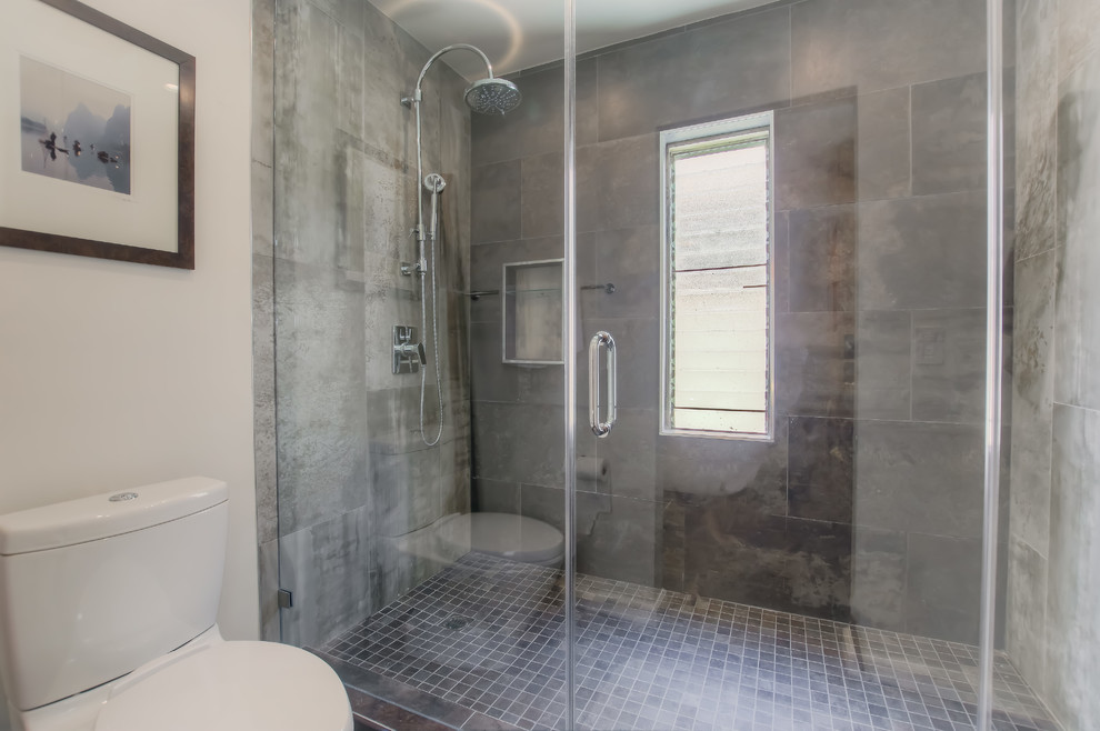 Inspiration for a large contemporary ensuite bathroom in Los Angeles with open cabinets, medium wood cabinets, a japanese bath, an alcove shower, grey tiles, ceramic tiles, grey walls, concrete flooring, a vessel sink, wooden worktops, grey floors and a hinged door.