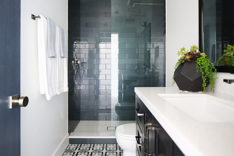 Inspiration for a mid-sized contemporary kids' multicolored tile and glass tile mosaic tile floor doorless shower remodel in Orange County with shaker cabinets, black cabinets, a one-piece toilet, white walls, a drop-in sink and marble countertops