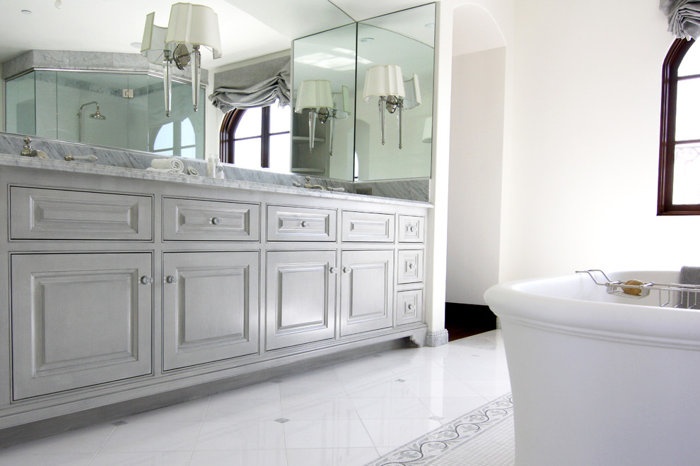 Large elegant master white tile and stone tile marble floor bathroom photo in Orange County with furniture-like cabinets, gray cabinets, marble countertops, a two-piece toilet, an undermount sink and white walls