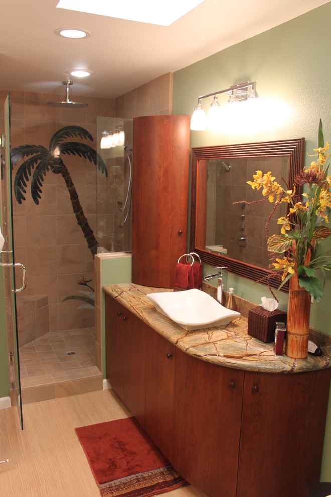 Medium sized world-inspired ensuite bathroom in Orange County with a vessel sink, flat-panel cabinets, medium wood cabinets, marble worktops, a freestanding bath, an alcove shower, a two-piece toilet, beige tiles, porcelain tiles, green walls and porcelain flooring.