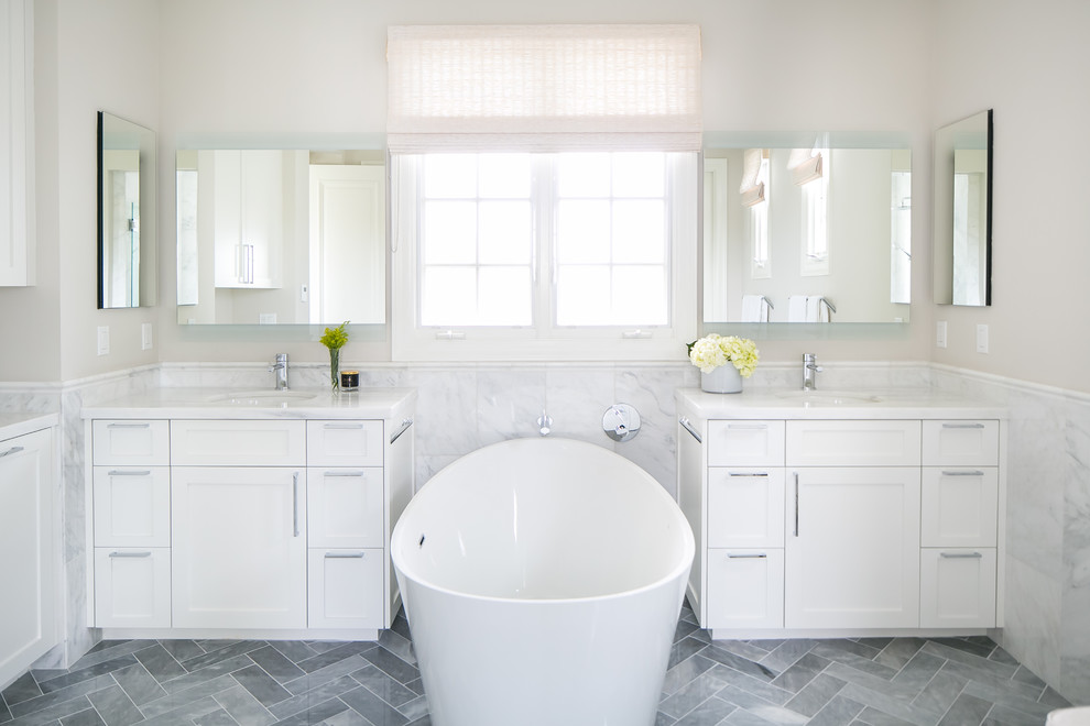 Bathroom - large mediterranean master gray tile and marble tile marble floor and gray floor bathroom idea in Orange County with shaker cabinets, white cabinets, a two-piece toilet, gray walls, an undermount sink, quartz countertops and a hinged shower door