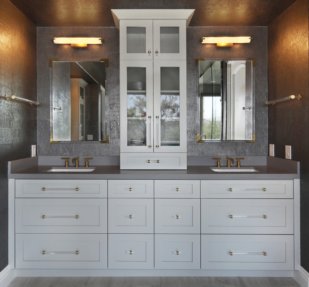 Design ideas for a medium sized contemporary ensuite wet room bathroom in Orange County with shaker cabinets, white cabinets, a freestanding bath, black and white tiles, marble tiles, grey walls, light hardwood flooring, engineered stone worktops, grey floors, a sliding door and grey worktops.
