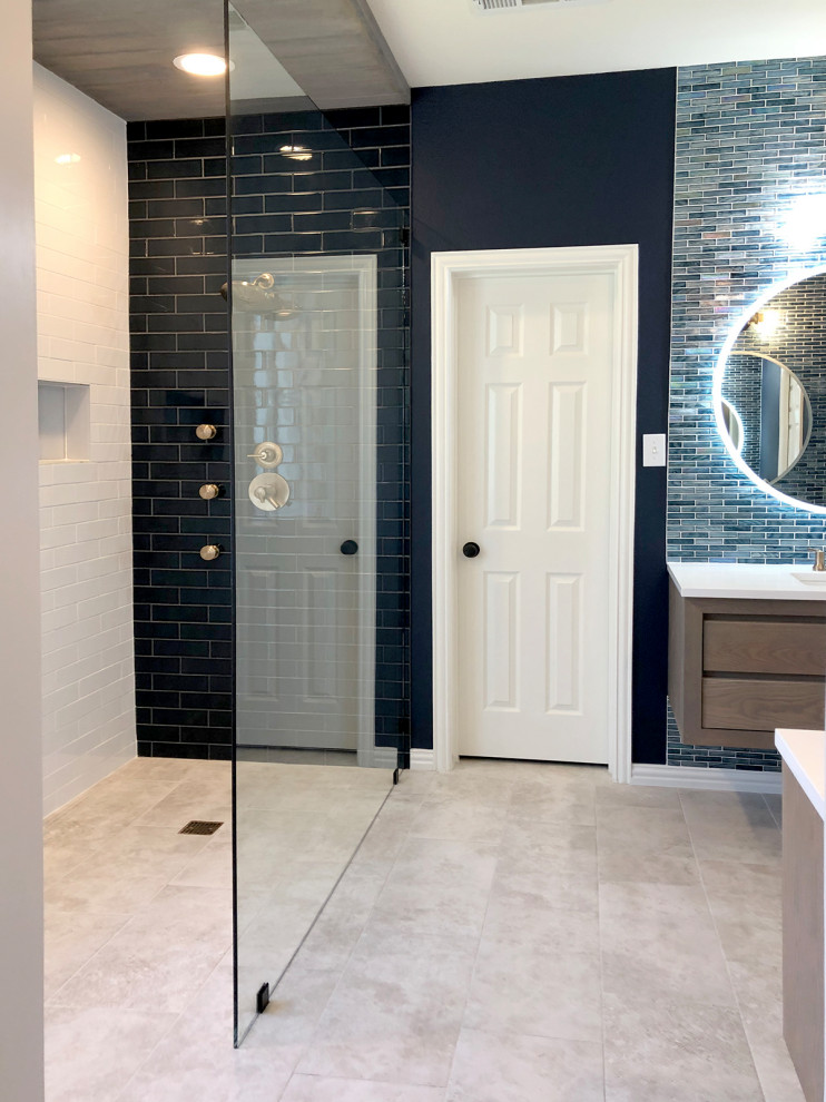 Inspiration for a mid-sized contemporary master blue tile and glass tile porcelain tile and gray floor bathroom remodel in Dallas with distressed cabinets, blue walls, an undermount sink and white countertops