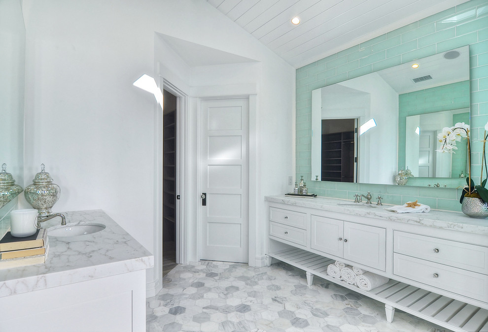 Design ideas for a bohemian bathroom in Orange County with white tiles and marble flooring.