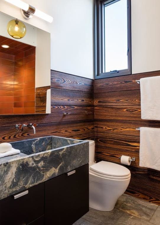 This is an example of a medium sized contemporary ensuite bathroom in Providence with flat-panel cabinets, dark wood cabinets, an alcove shower, a one-piece toilet, blue tiles, metro tiles, white walls, porcelain flooring, a submerged sink and granite worktops.