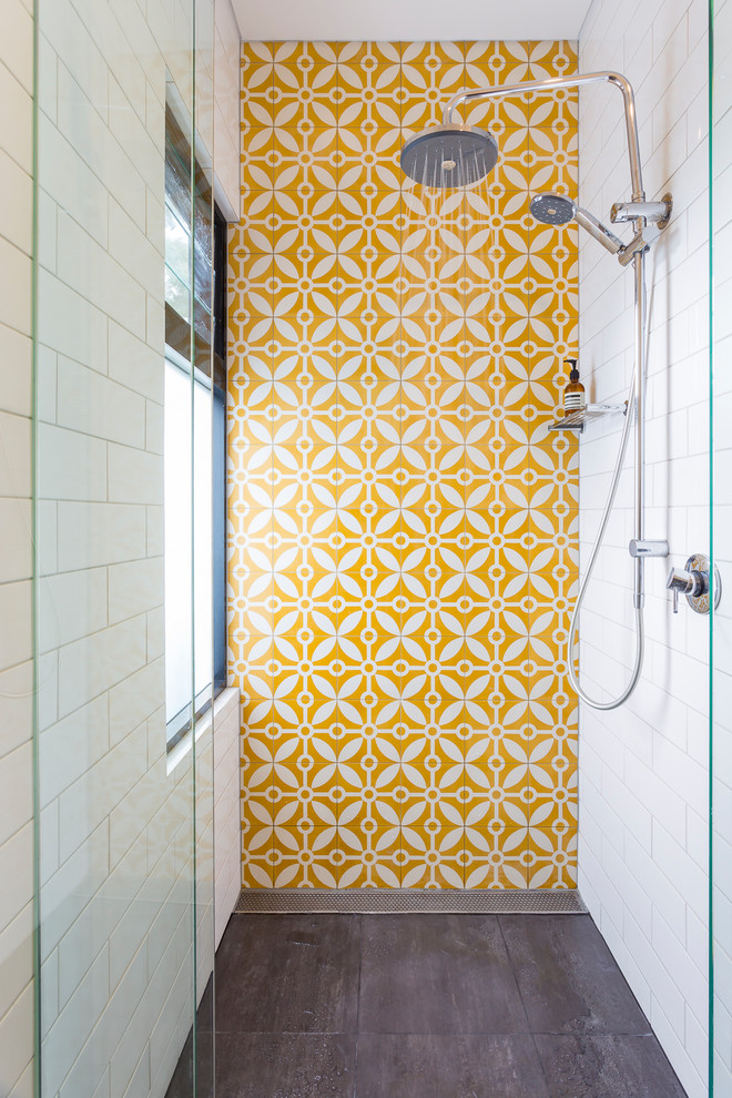 This is an example of a contemporary grey and yellow bathroom in Sydney with an alcove shower.