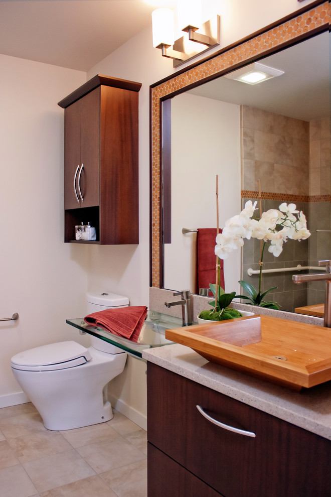 Photo of a small bohemian bathroom in San Francisco with an integrated sink, flat-panel cabinets, dark wood cabinets, glass worktops, a built-in shower, green tiles and porcelain tiles.