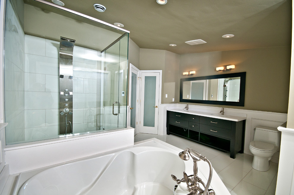 Bathroom - mid-sized contemporary master beige tile and porcelain tile porcelain tile and white floor bathroom idea in Toronto with an undermount sink, a one-piece toilet, flat-panel cabinets, beige walls, black cabinets, quartz countertops and a hinged shower door