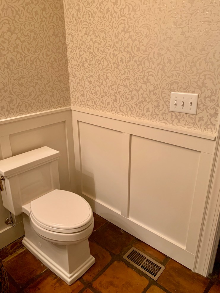 Design ideas for a medium sized traditional cloakroom in Kansas City with a two-piece toilet and a pedestal sink.