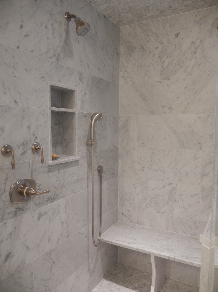 Mid-sized beach style 3/4 gray tile and marble tile marble floor and gray floor alcove shower photo in New York with beaded inset cabinets, gray cabinets, a two-piece toilet, gray walls, an undermount sink, quartz countertops and a hinged shower door