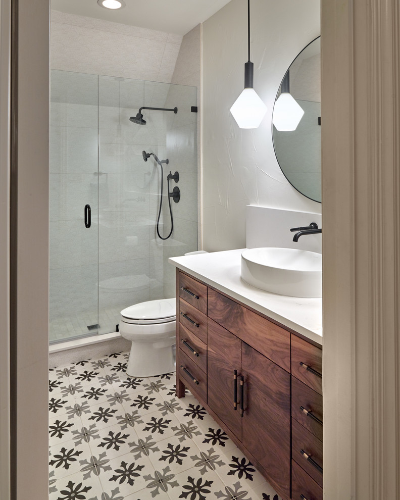 Mid-sized eclectic 3/4 white tile and porcelain tile cement tile floor and black floor alcove shower photo in Dallas with flat-panel cabinets, yellow cabinets, a one-piece toilet, white walls, a vessel sink, quartz countertops, a hinged shower door and white countertops