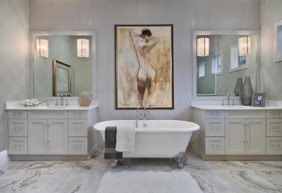 Inspiration for a mid-sized transitional master marble floor and white floor claw-foot bathtub remodel in Miami with an undermount sink, recessed-panel cabinets, white cabinets, quartz countertops and white walls
