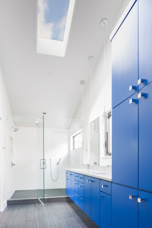 Large shower in blue bathroom