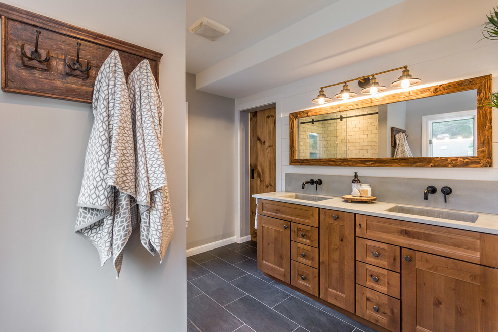 Photo of a medium sized classic ensuite bathroom in Boston with shaker cabinets, medium wood cabinets, grey walls, slate flooring, grey floors, an integrated sink, concrete worktops and grey worktops.