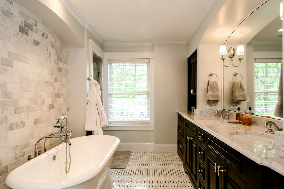 Example of a classic master gray tile and ceramic tile ceramic tile bathroom design in DC Metro with an undermount sink, raised-panel cabinets, dark wood cabinets, marble countertops and beige walls