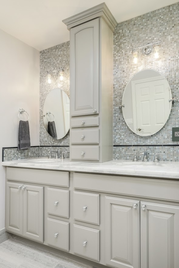 Large traditional ensuite bathroom in Sacramento with raised-panel cabinets, grey cabinets, a corner shower, grey tiles, mosaic tiles, beige walls, laminate floors, a submerged sink, quartz worktops, beige floors, a hinged door and white worktops.
