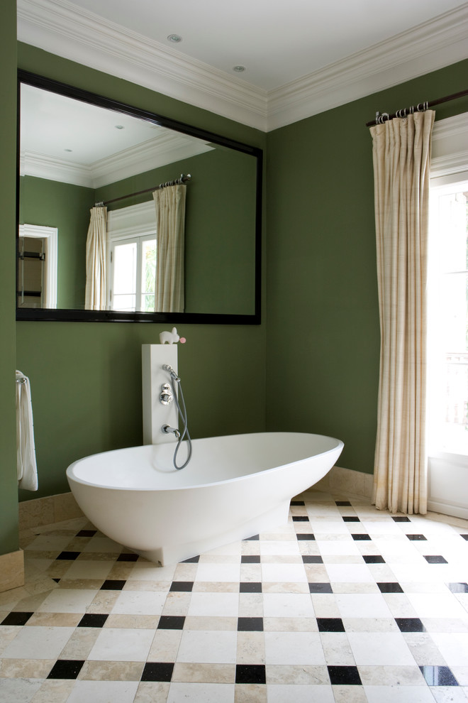 Trendy multicolored floor freestanding bathtub photo in Miami with green walls