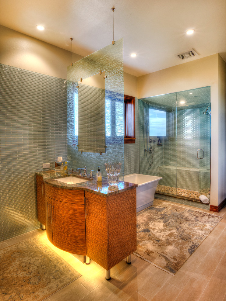 Example of a mid-sized beach style master blue tile and porcelain tile porcelain tile bathroom design in Tampa with a drop-in sink, flat-panel cabinets, light wood cabinets, granite countertops, a one-piece toilet and blue walls