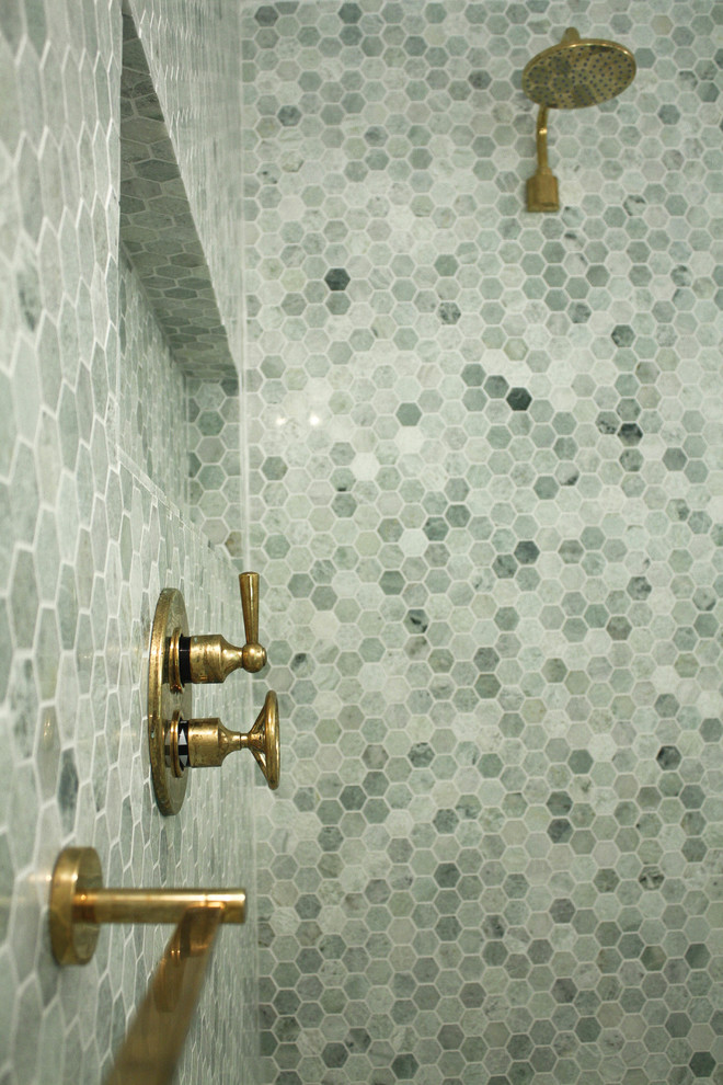 Photo of a modern bathroom in New York with a walk-in shower, green tiles, stone tiles and green walls.