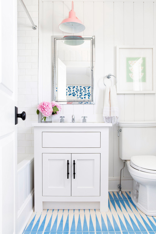 Charming Shiplap: White Washstand and Pink Pendant Light in a Blue and White Bathroom