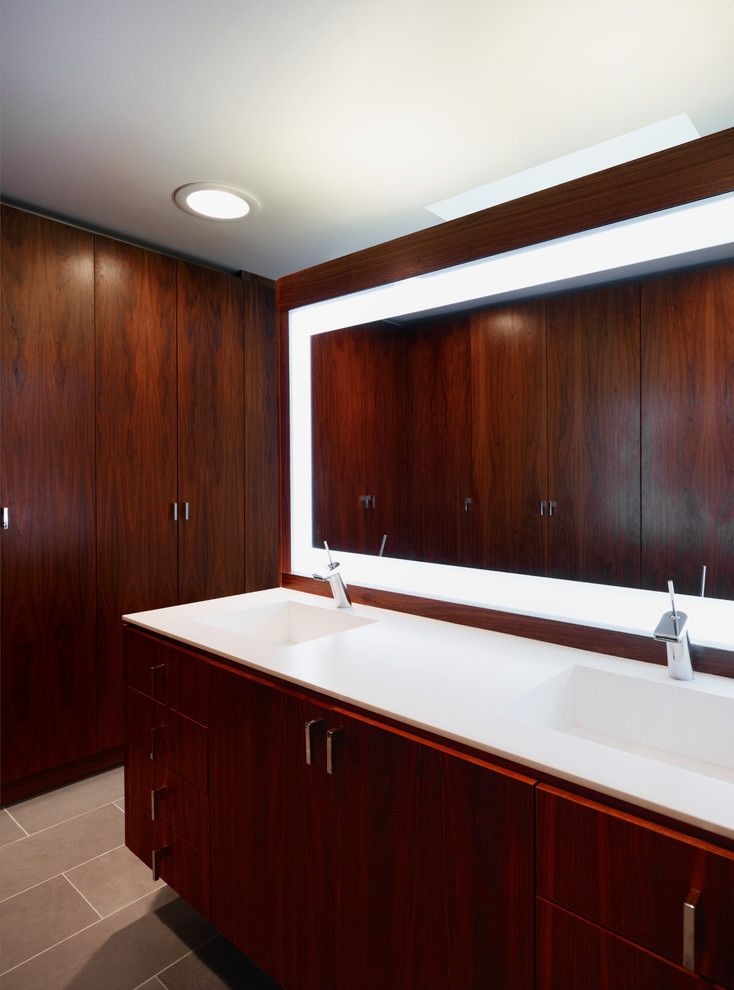 Example of a large trendy master slate floor bathroom design in Toronto with an integrated sink, flat-panel cabinets, dark wood cabinets and white walls