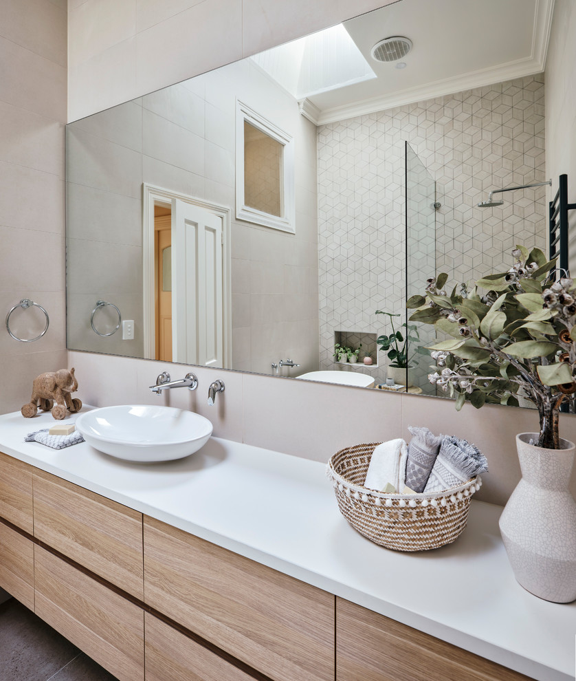 Contemporary bathroom in Melbourne with a freestanding bath, a walk-in shower, beige tiles, ceramic tiles, beige walls, ceramic flooring, grey floors and an open shower.
