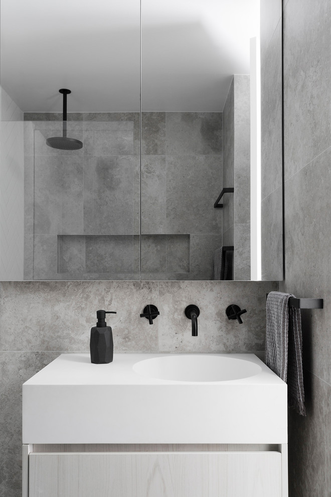 This is an example of a contemporary bathroom in Melbourne with flat-panel cabinets, light wood cabinets, grey walls and a built-in sink.