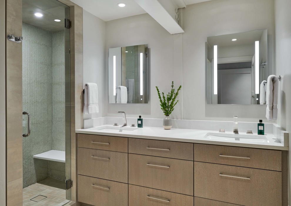 Medium sized modern ensuite bathroom in Denver with flat-panel cabinets, beige cabinets, an alcove shower, green tiles, stone tiles, white walls, porcelain flooring, a submerged sink, engineered stone worktops, beige floors, a hinged door and white worktops.