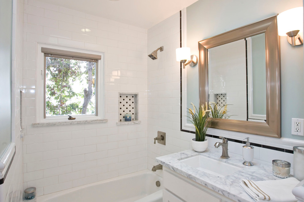 Bathroom - traditional white tile and subway tile bathroom idea in San Diego with an undermount sink and white cabinets