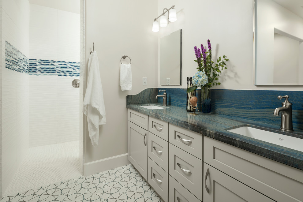 Inspiration for a mid-sized southwestern kids' white tile and ceramic tile cement tile floor and black floor bathroom remodel in Phoenix with furniture-like cabinets, black cabinets, a one-piece toilet, white walls, a vessel sink, granite countertops and blue countertops