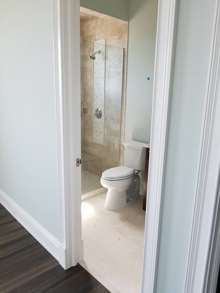 Small beach style master doorless shower photo in Miami