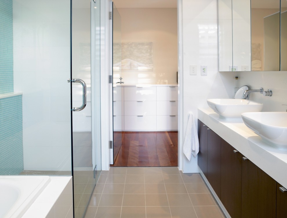 Contemporary bathroom in Sydney with a built-in shower, beige tiles and white walls.