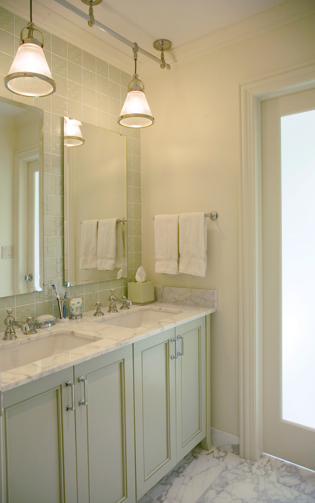Inspiration for a contemporary bathroom in Chicago with recessed-panel cabinets and feature lighting.