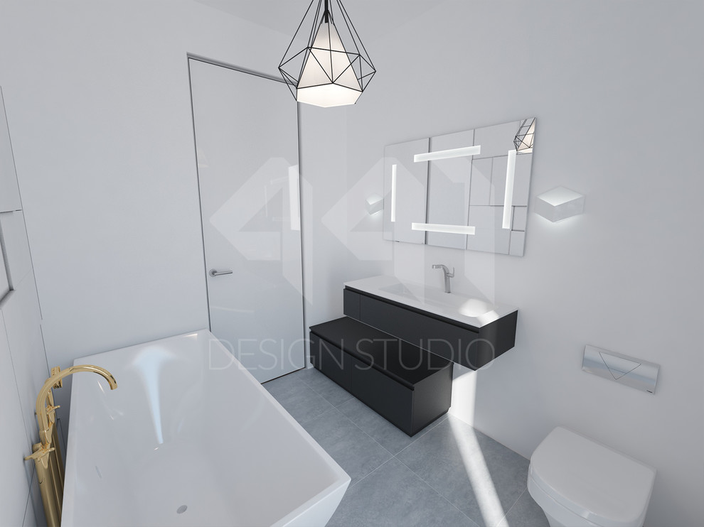 This is an example of a medium sized scandi ensuite bathroom in Other with an integrated sink, freestanding cabinets, black cabinets, a freestanding bath, a one-piece toilet, white tiles, ceramic tiles, white walls and porcelain flooring.