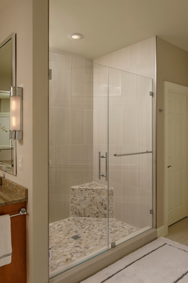 Large traditional ensuite bathroom in DC Metro with a submerged sink, shaker cabinets, light wood cabinets, granite worktops, a freestanding bath, an alcove shower, a one-piece toilet, grey tiles, porcelain tiles and grey walls.