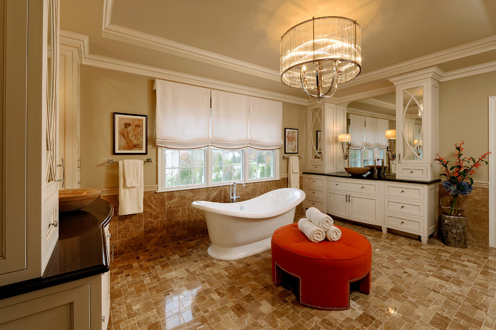 Example of a large classic master beige tile and stone tile marble floor bathroom design in DC Metro with a vessel sink, furniture-like cabinets, white cabinets, quartz countertops, a one-piece toilet and beige walls