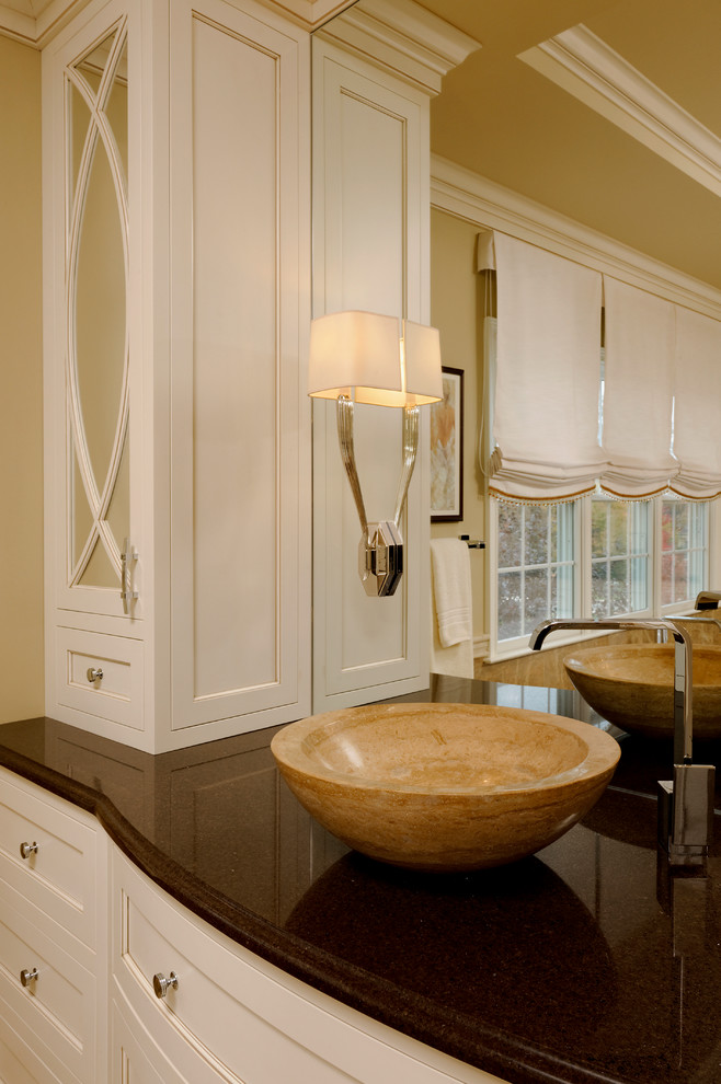 Example of a large classic master beige tile and stone tile marble floor bathroom design in DC Metro with a vessel sink, furniture-like cabinets, white cabinets, quartz countertops, a one-piece toilet and beige walls