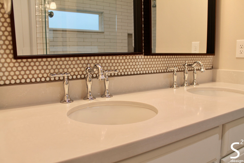 Mid-sized transitional master white tile and porcelain tile porcelain tile and gray floor bathroom photo in Houston with raised-panel cabinets, white cabinets, a two-piece toilet, beige walls, an undermount sink, quartz countertops and gray countertops