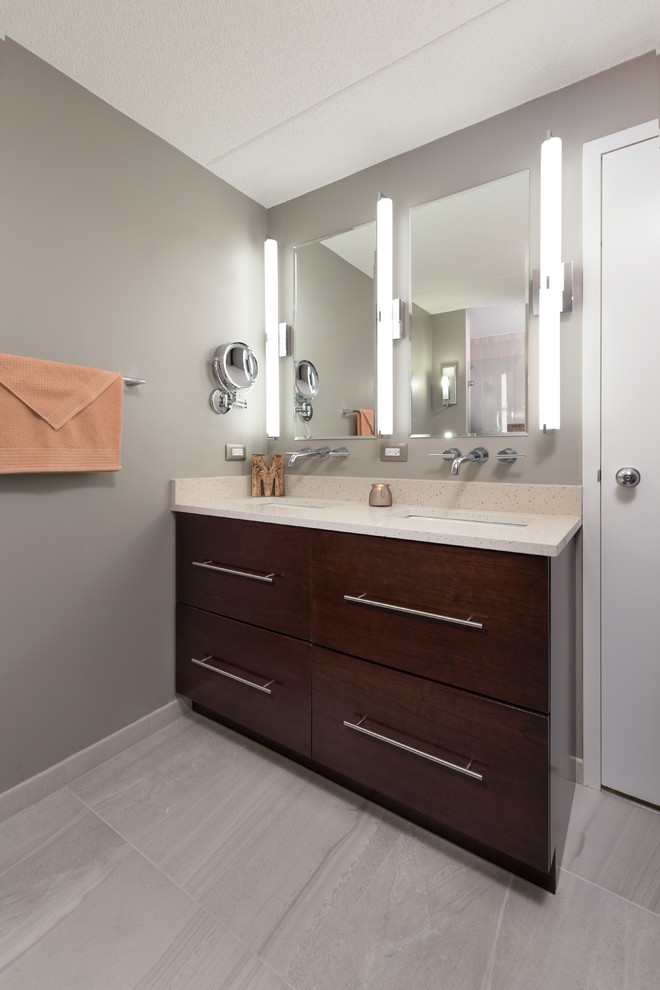 Medium sized contemporary ensuite bathroom in Chicago with flat-panel cabinets, dark wood cabinets, a built-in shower, a one-piece toilet, grey tiles, stone tiles, grey walls, ceramic flooring, a built-in sink and quartz worktops.