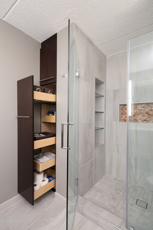Clever Solutions: Gray Walk-in Shower with Innovative Bathroom Storage Ideas