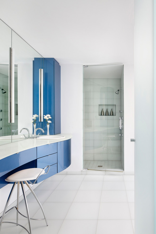 Trendy white tile alcove shower photo in Chicago with a drop-in sink, flat-panel cabinets and blue cabinets